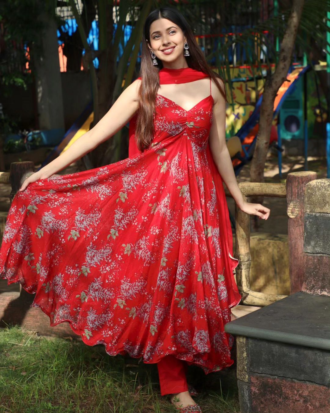 Wish to wear a simple suit? Then go red with Alice Kaushik’s strappy Anarkali, paired with pants and a matching dupatta.
 