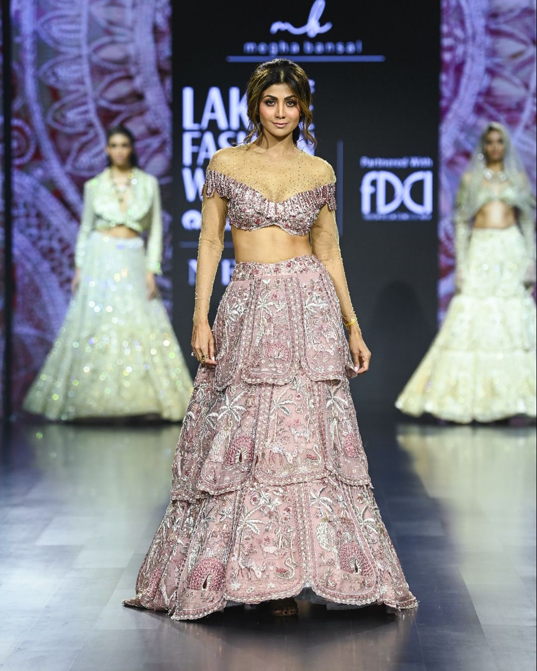 Shilpa Shetty dazzled as the grand showstopper for Megha Bansal at the FDCI X Lakme Fashion Week, captivating everyone with her poise and charm.