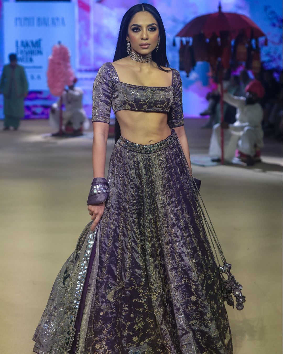 Sobhita Dhulipala graced the ramp for designer Punit Balana, showcasing a stunning wine-toned lehenga ensemble that radiated elegance and glamour