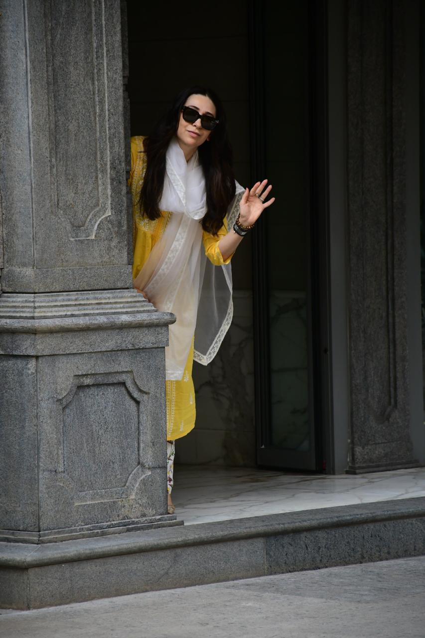 Karishma Kapoor was spotted at Randhir Kapoor's house in Bandra. The actress looked stunning in a yellow suit