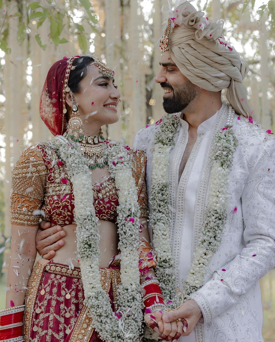 The ceremony took place at Aahana Luxury Resort at Jim Corbett National Park in Uttarakhand. Surbhi’s choice of bridal trousseau was loved by netizens as she flaunted the traditional red color.