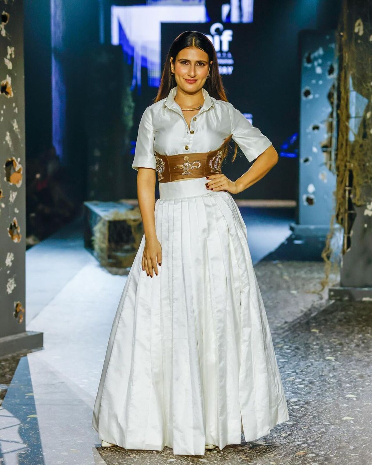 Actress Fatima Sana Shaikh, graced the runway as the showstopper wearing a stunning creation from NIF students Chetan Mali and Mahendra Choudhary.She looked radiant in a perfectly fitted ivory outfit that featured an off-white shirt paired with a flared skirt, cinched at the waist with a bold brown belt