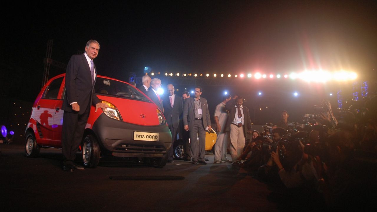 Tata Group Chairman Ratan Tata poses with the newly-launched Nano at Parsi Gymkhana in Mumbai