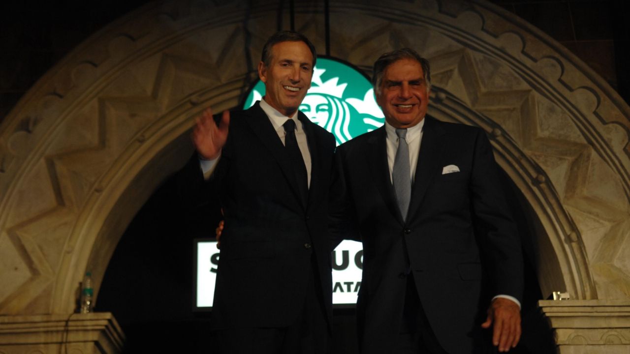 Ratan Tata, Chairman of TATA Group and Howard Schultz, CEO and Chairman of Starbucks Coffee during their outlets inauguration near Horniman Circle, Fort