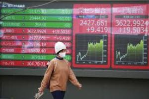 Asian markets climb as Japan’s ruling party loses majority, yen weakens