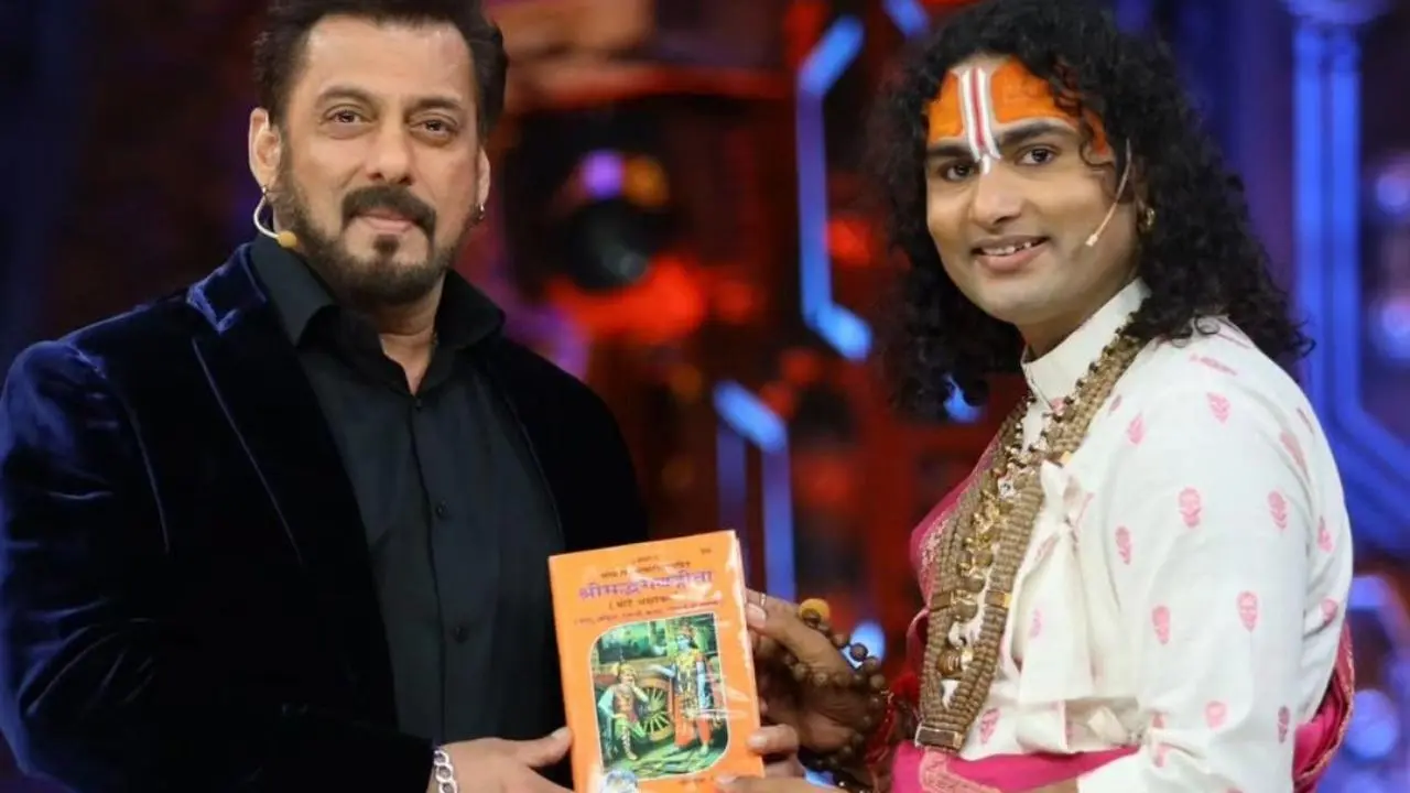 In the picture, Aniruddhacharya is seen presenting Salman Khan with a copy of the Bhagwat Gita, which the actor accepted with a smile, take a look at the actor's reaction. Read More