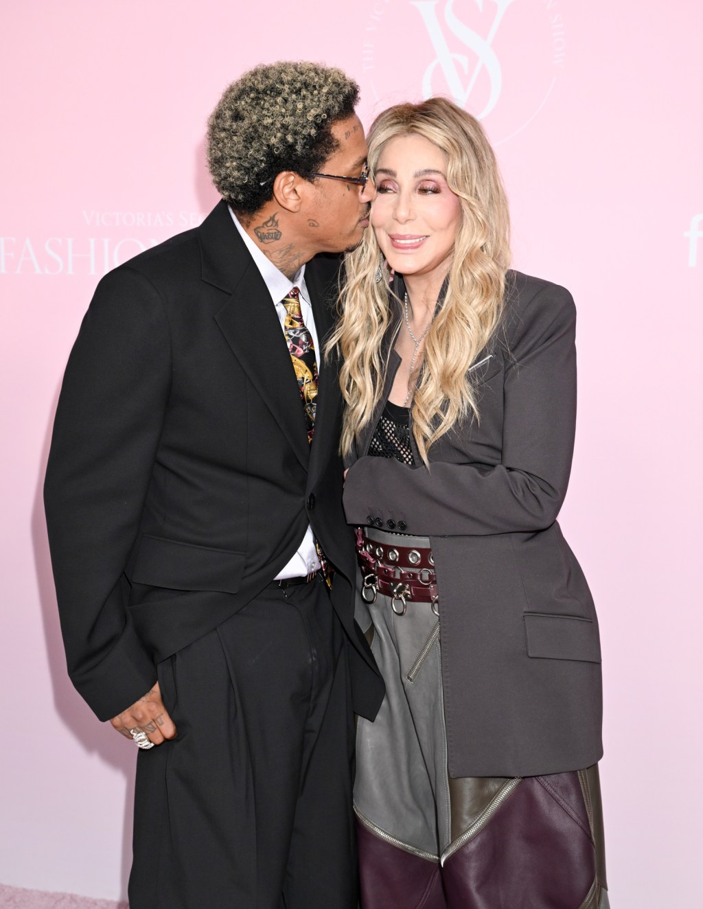 Cher gets a kiss from her boyfriend Alexander ‘AE’ Edwards on Victoria’s Secret Fashion Show 2024 pink carpet